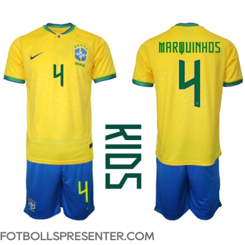 Brasilien Marquinhos #4 Hemmatröja Barn VM 2022 Kortärmad (+ korta byxor)